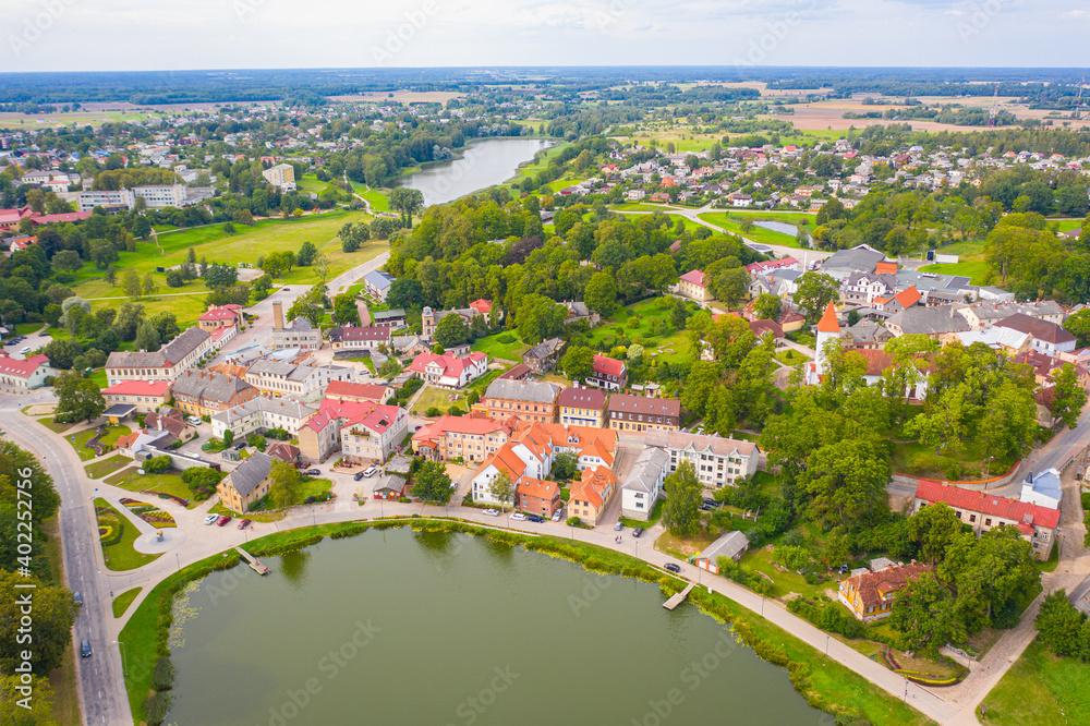 Talsi, Latvia, Baltics. Aerial view photo from flying drone panoramic to Talsi old town and new town on a sunny summer day. (Series) - obrazy, fototapety, plakaty 