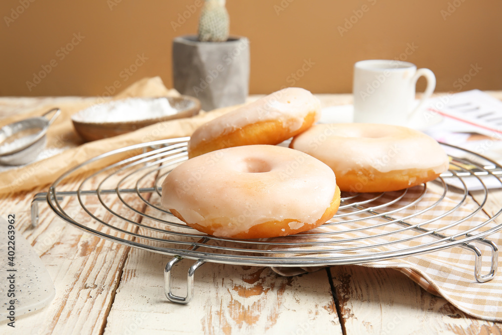 Tasty donuts on wooden table