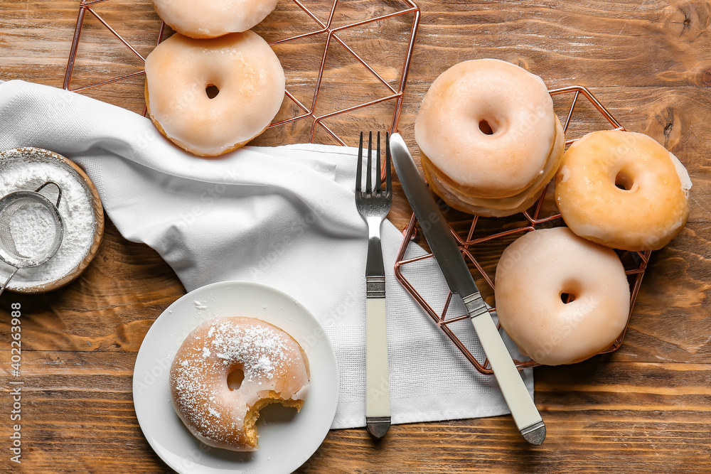 Tasty donuts on wooden background