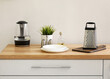 © Pixel-Shot - Grater, kettle and plates on kitchen counter