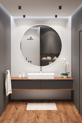 Black and white bathroom with a large round mirror on a white mosaic wall, an overhead washbasin on a wooden cabinet, an orchid, a towel, a rug on a wooden floor. 3d render