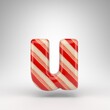 Letter U lowercase on white background. Candy cane 3D letter with red and white lines.