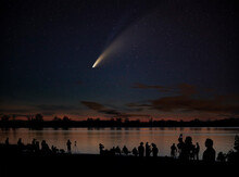 Comet Neowise Comet C/2020 F3 (NEOWISE) And Crowd Of People  Silhouetted By The Ottawa River Watching And Photographing The Comet