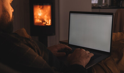 Crop freelancer using laptop with blank screen