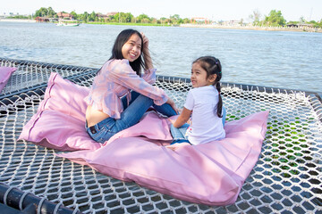 Wall Mural - Little Girl and Mother at The River