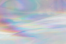 Rainbow Halographic Wrinkled Foil Background. Abstract Pastel Color Background.