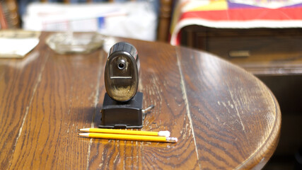 Pencils in Front of a Sharpener