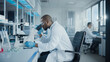 © Gorodenkoff - Medical Development Laboratory: Portrait of Black Male Scientist Looking Under Microscope, Analyzing Petri Dish Sample. Professionals Doing Research in Advanced Scientific Lab. Side View Shot