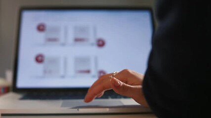 Poster - A hand uses a touchpad on a laptop in the office to demonstrate business development graph. Against background, the picture is moving in monitor bokeh. Computer control by pressing your finger.