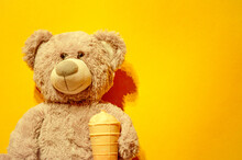 Gray Toy Bear In Its Paws Ice Cream