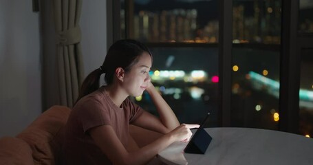 Sticker - Woman watch on tablet computer at home