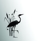A heron  stands behind a cattail bush. Vector silhouette drawing.