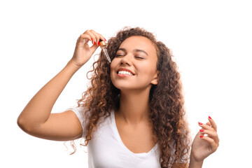 Wall Mural - Beautiful young woman with cosmetic oil on white background