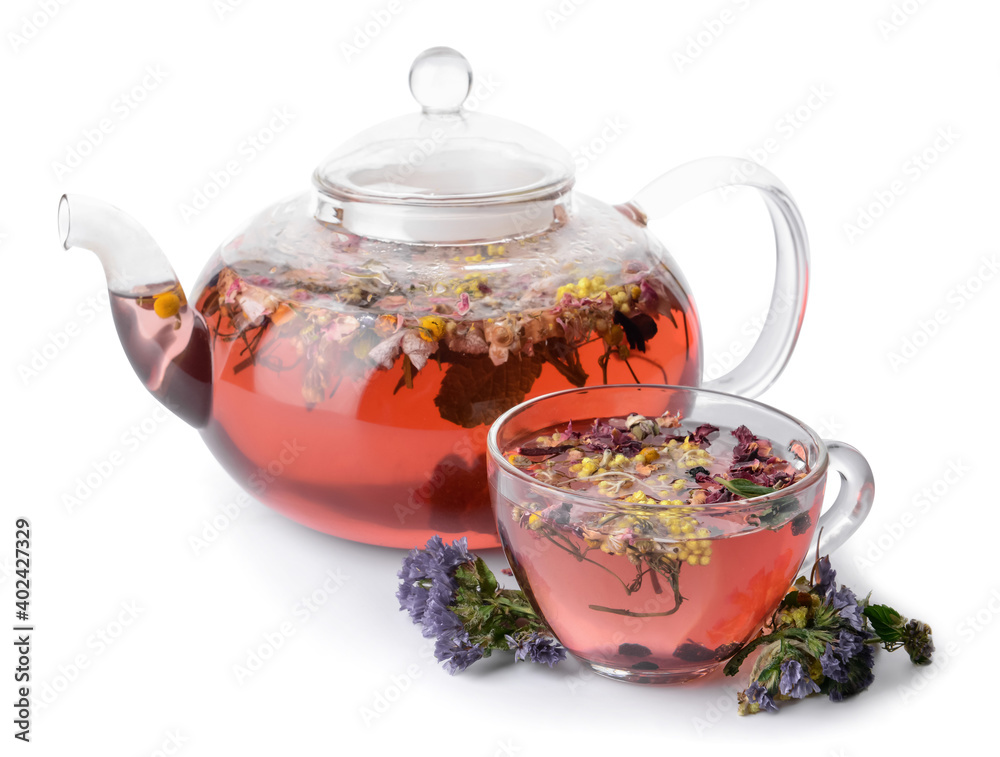 Cup and teapot with floral tea on white background