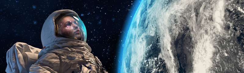 Wall Mural - an astrounaut in outer space against the earth on background