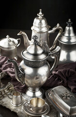 Wall Mural - Silver dishes on old background