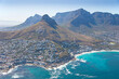 © Grant Duncan-Smith - Cape Town, Western Cape, South Africa - 12.22.2020: Aerial photo of Clifton and Camps Bay with Lions Head and Table Mountain in the background