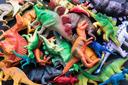 Wall Mural - Pile of toy plastic dinosaurs