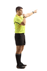 Wall Mural - Side view of a football referee blowing a whistle