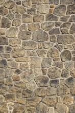Vertical Detail Of Ancient Mosaic Stone Wall With Irregular  Fitted Stone Shapes And Contrasting Grout