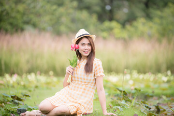 Portrait beautiful asian woman lifestyle resting in the park, relaxation concept, mind care