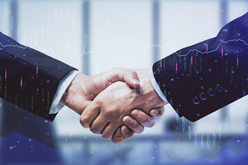 Double exposure of forex graph hologram and handshake of two men. Stock market concept.