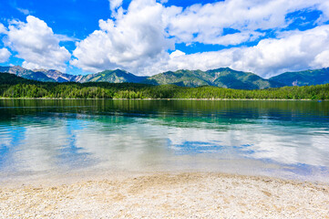 Paradise beach at Eibsee lake.  Beautiful landscape scenery with clear blue water in German Alps at Zugspitze mountain - Garmisch Partenkirchen, Grainau - Bavaria, Germany, Europe.