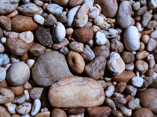 Wall Mural - pebbles on the beach, white stone background