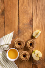 Baked Apple Cider Donuts And Napkin On Wood