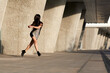 © aitorserra - young attractive woman in short dress running