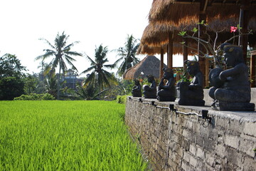 Beautiful view of buddhist statues and palm trees in background, Bali, Indonesia