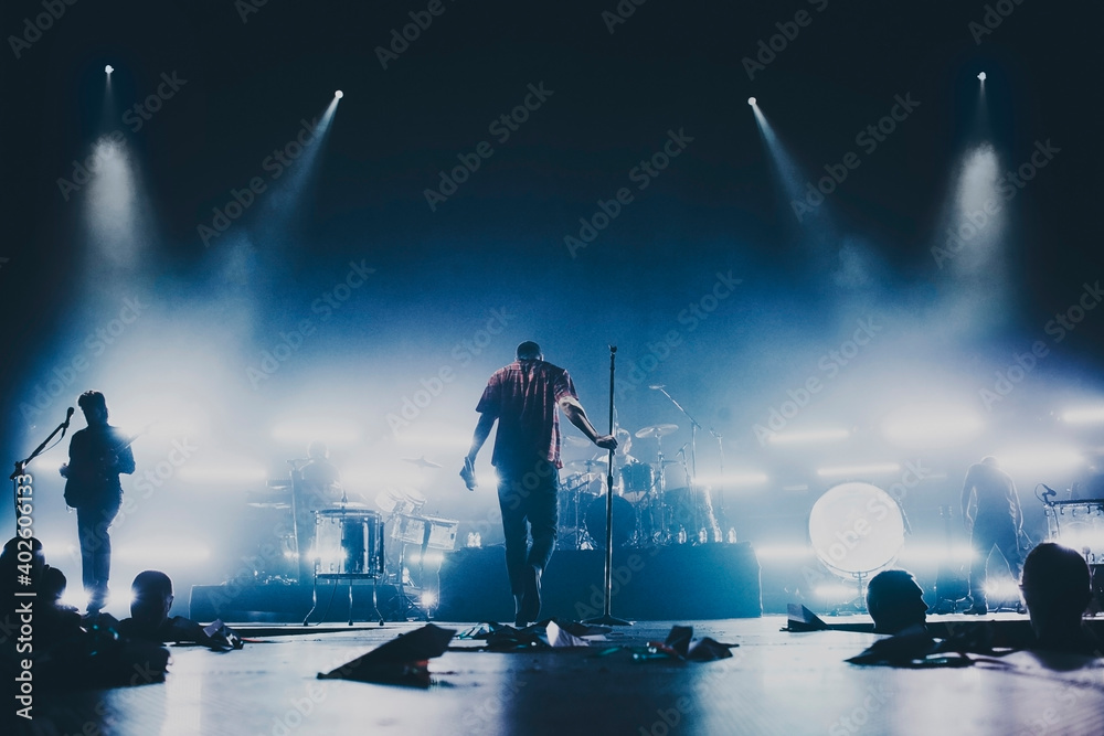 Singer Concert Background Music band silhouette perform on a concert stage. Dark background ...