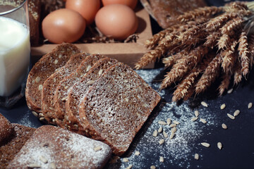 Bakery and grocery concept. Fresh, healthy sorts of rye and white loaves food closeup. Fresh homemade bread with cereals.