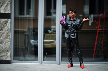 Wall Mural - World Cancer Day concept, February 4. African american woman hold purple ribbon awareness.