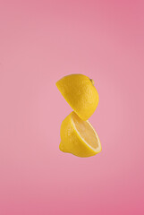 Two llemon halves floating  in the air.Creative food photography..