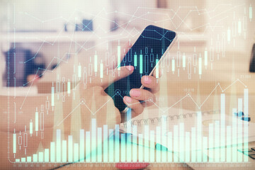Aufkleber - Double exposure of man's hands holding and using a digital device and forex graph drawing. Financial market concept.