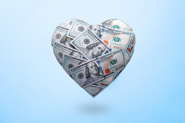 Heart shaped made with 100 dollar banknotes. Happy Valentine's day symbol. Love money concept