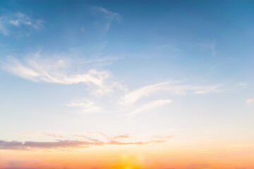 Wall Mural - Sky blue and orange light of the sun through the clouds in the sky