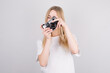 © Studio Nova - Happy smiling young girl holding camera and taking photos