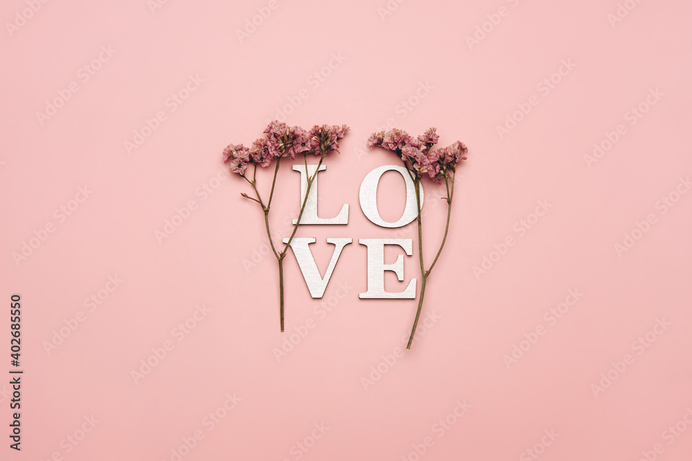Creative flat lay of word love on soft color  background with natural plants - obrazy, fototapety, plakaty 