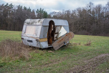 Ruined Trailer On The Meadow By The Forest