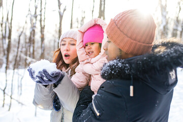 happiness excited people in warm clothing in winter outdoors