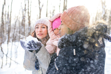 Wall Mural - happiness excited people in warm clothing in winter outdoors