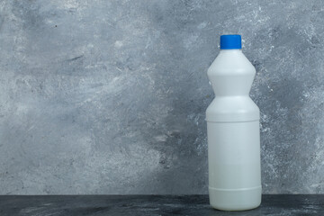 Wall Mural - White container of bleach on marble background
