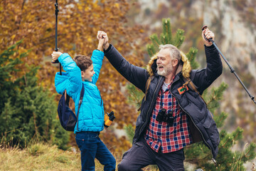 father with son hiking in nature