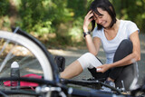 woman sits crying after bike accident