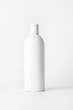 © MM - White bottle with shampoo on a light background..