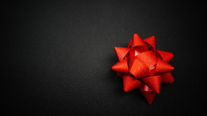 Red sparkling star ribbon on Black background