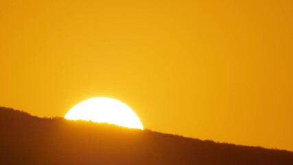 Poster - Big sun close-up rising at mountain.	 Beautiful nature video time lapse landscape.