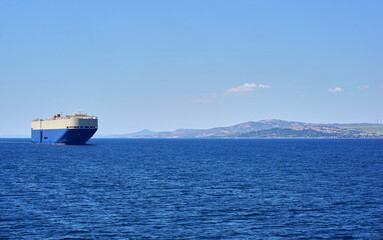 Big cargo ship crossing the strait